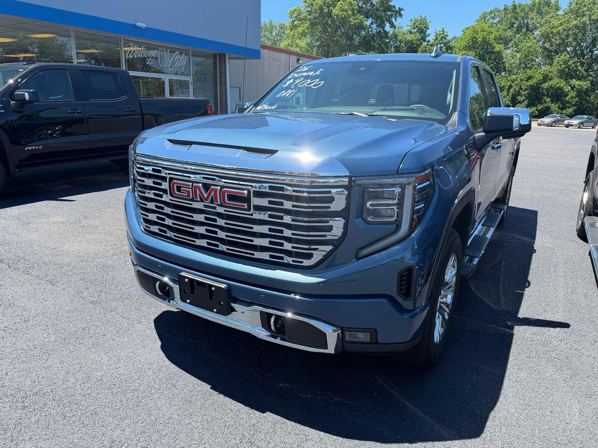 2026 GMC Sierra 1500 Denali in Downpour Metallic — front three-quarter view