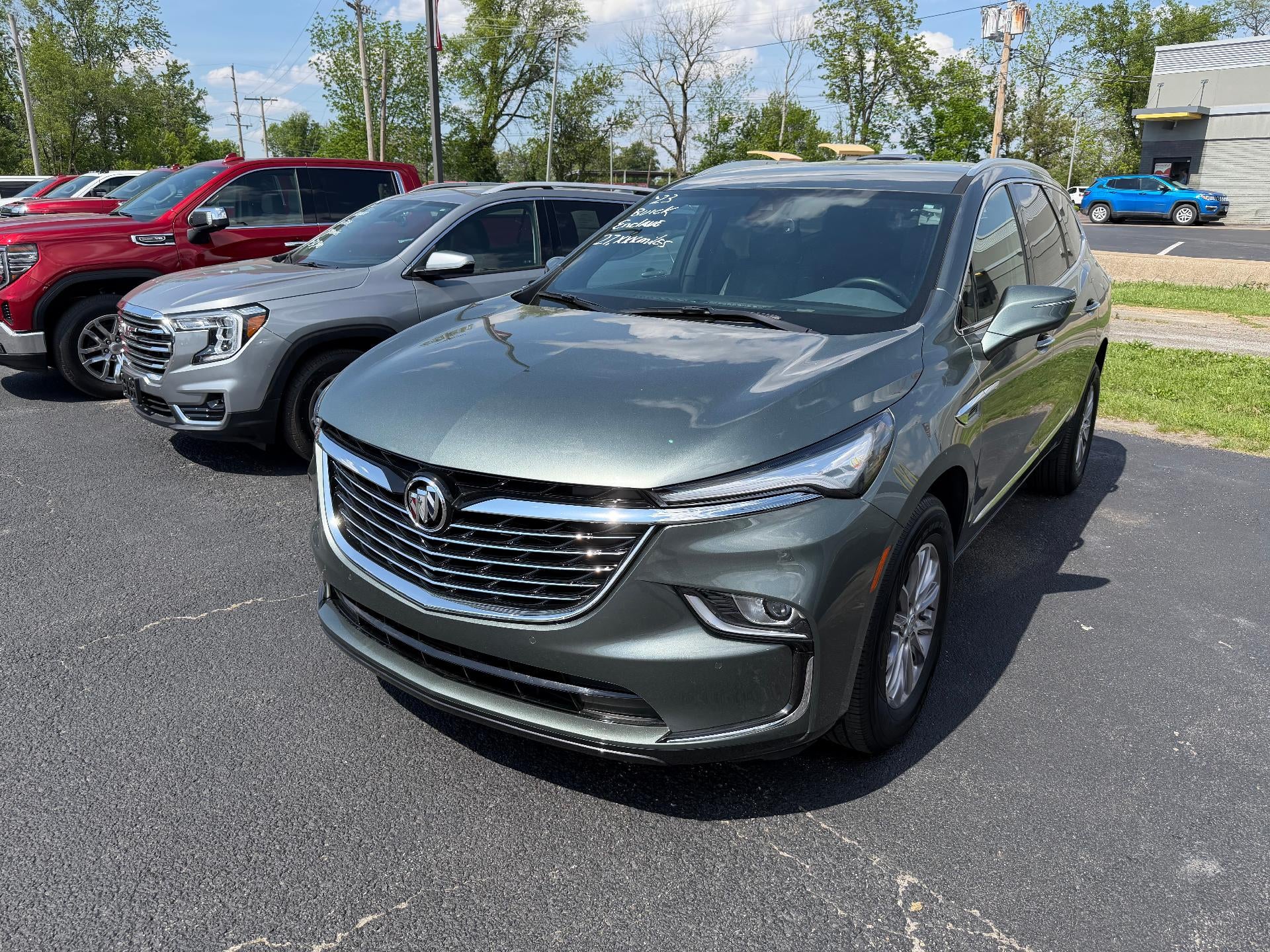 2023 Buick Enclave Essence in Sage Metallic — front three-quarter view